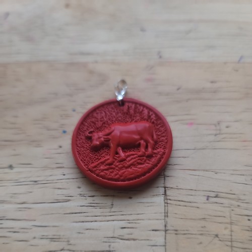 Carved red cinnabar - bull, eight